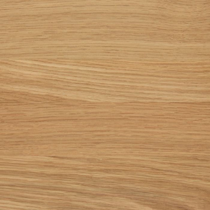 Close-up of a wooden surface with a light brown color and visible grain pattern.
