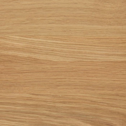 Close-up of a wooden surface with a light brown color and visible grain pattern.