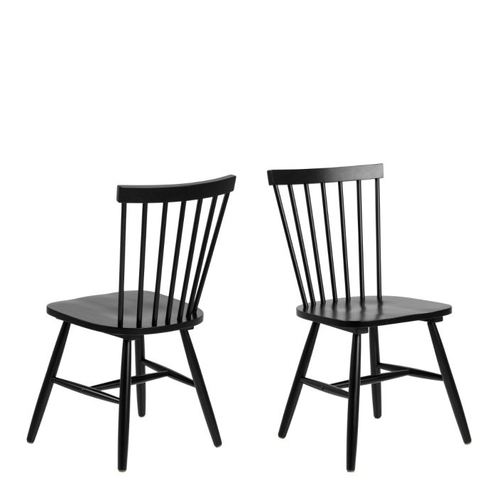 Two black wooden chairs on a white background