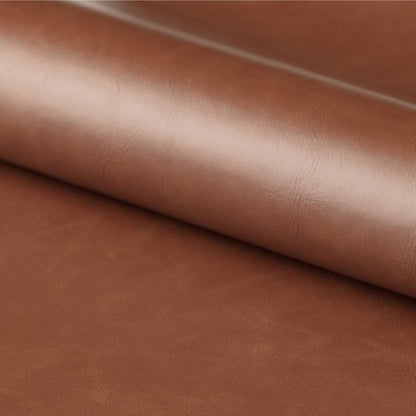 Close-up of brown leather fabric with a subtle texture