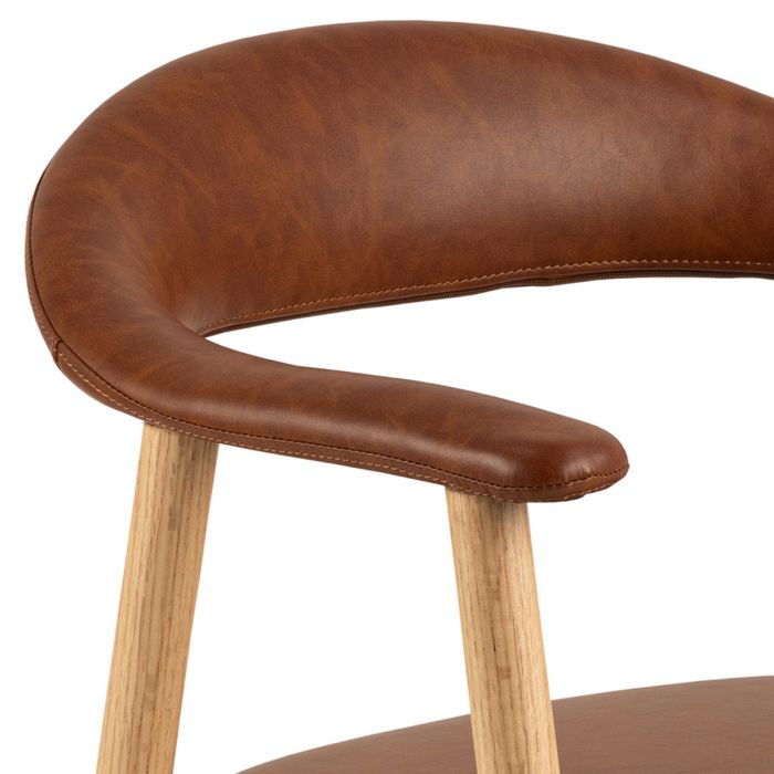 Brown leather stool with wooden legs on a white background