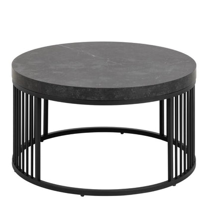 Round coffee table with black marble top and metal frame on a white background