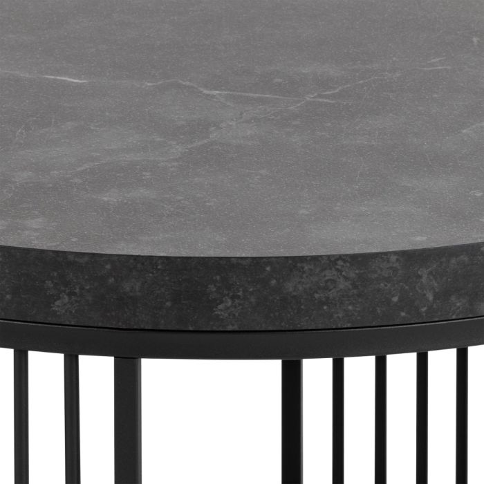 Round table with dark gray marble-like top and black metal base on a white background