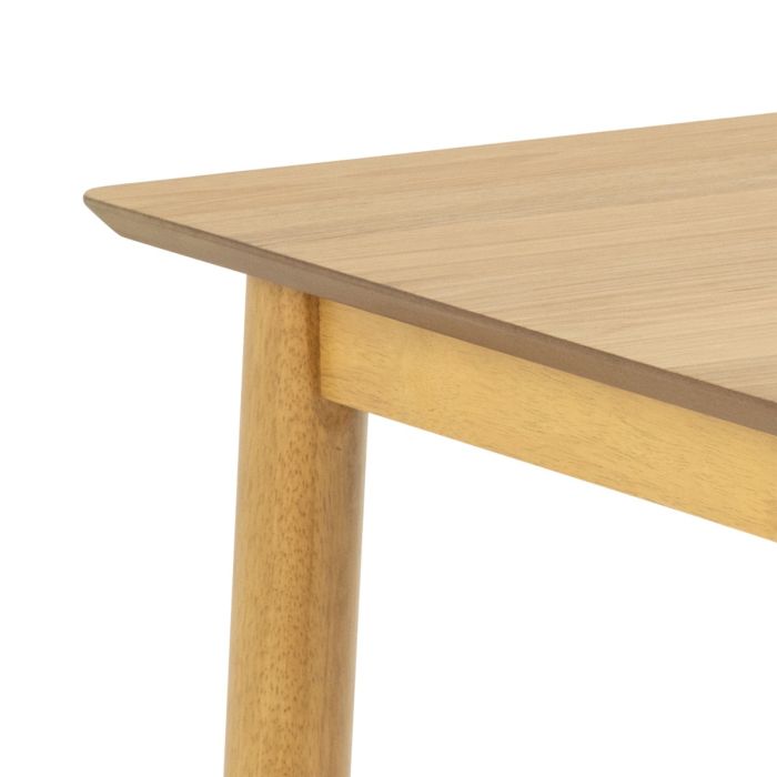 Close-up of a wooden table with a white background