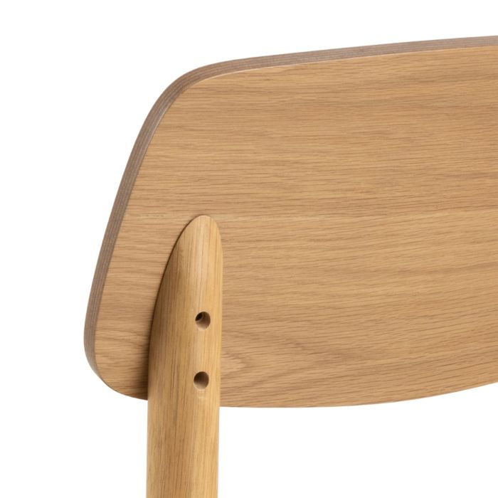 Close-up of a wooden chair seat and backrest on a white background