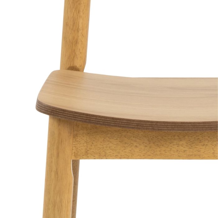Close-up of a wooden chair seat on a white background