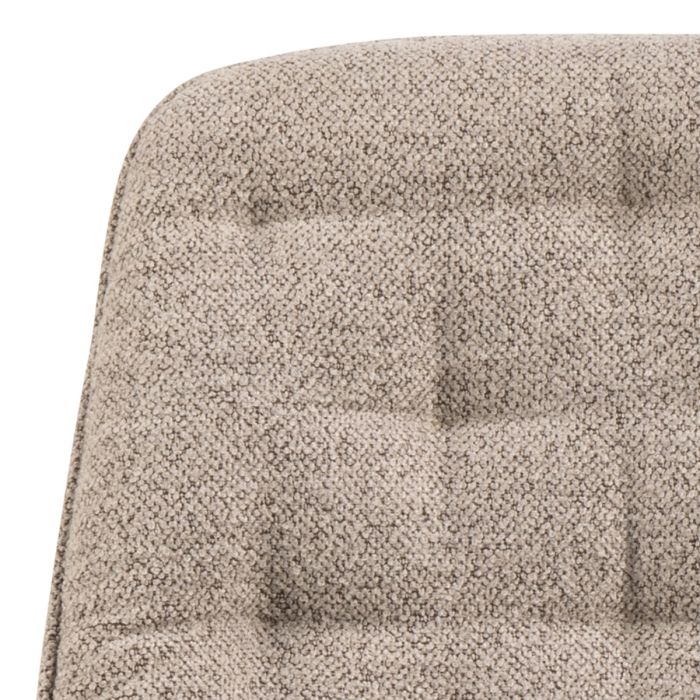 Close-up of a textured beige cushion on a chair