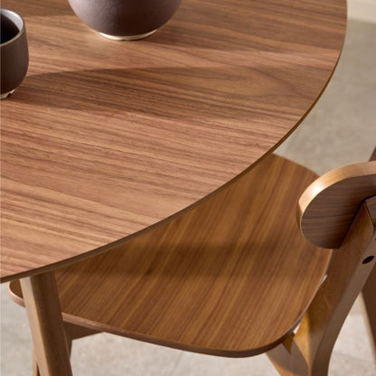 Wooden dining table with a chair, featuring a warm brown finish.