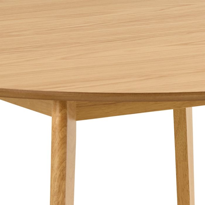 Close-up of a wooden table with a light finish on a white background