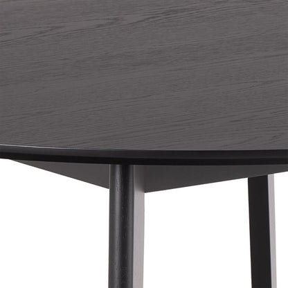 Round black table with a white background