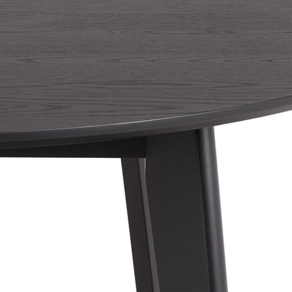 Close-up of a dark gray wooden table with a white background