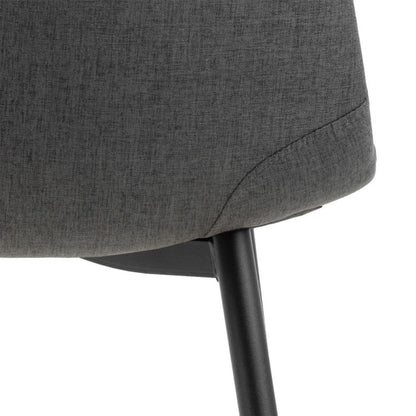 Gray upholstered chair with a black metal leg on a white background