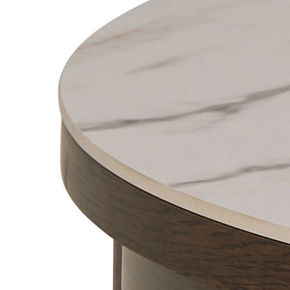 Round marble table with wooden base on a white background