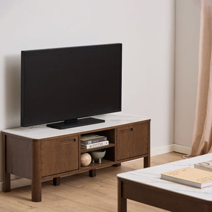 Modern living room with a wooden TV stand and a flat-screen TV.