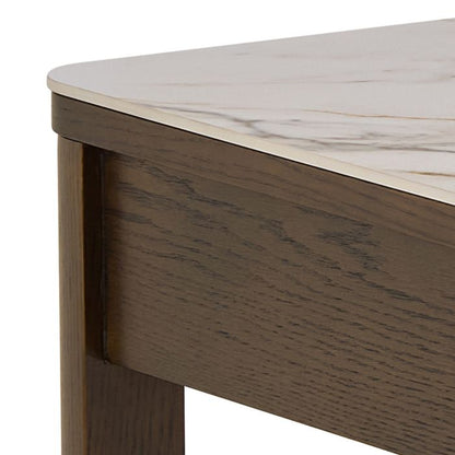 Close-up of a wooden desk with a marble-like top