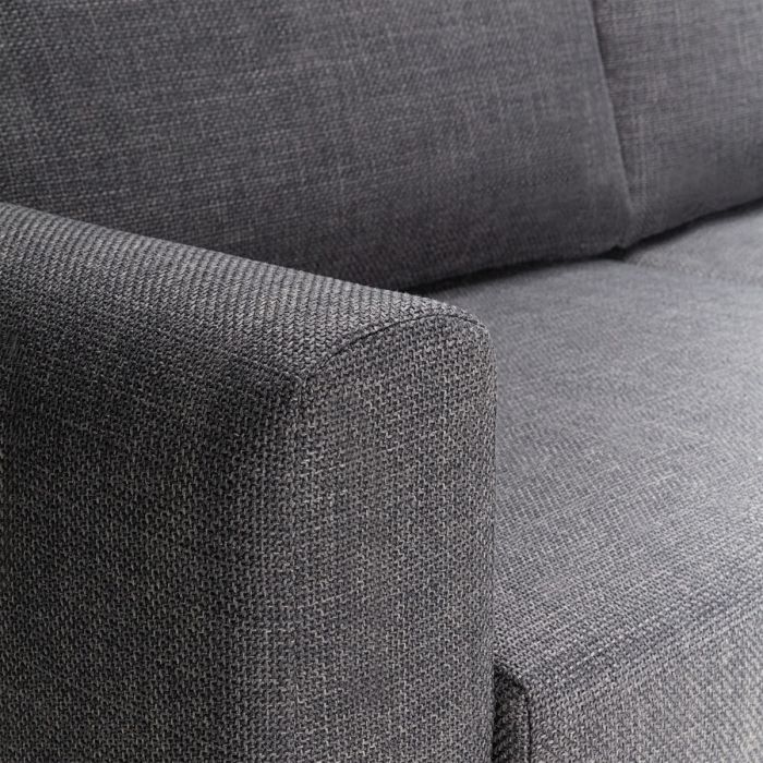 Close-up of a gray fabric sofa corner