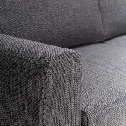 Close-up of a gray fabric sofa corner