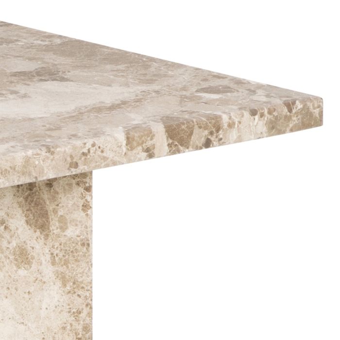 Close-up of a marble table top with a beige and brown pattern on a white background
