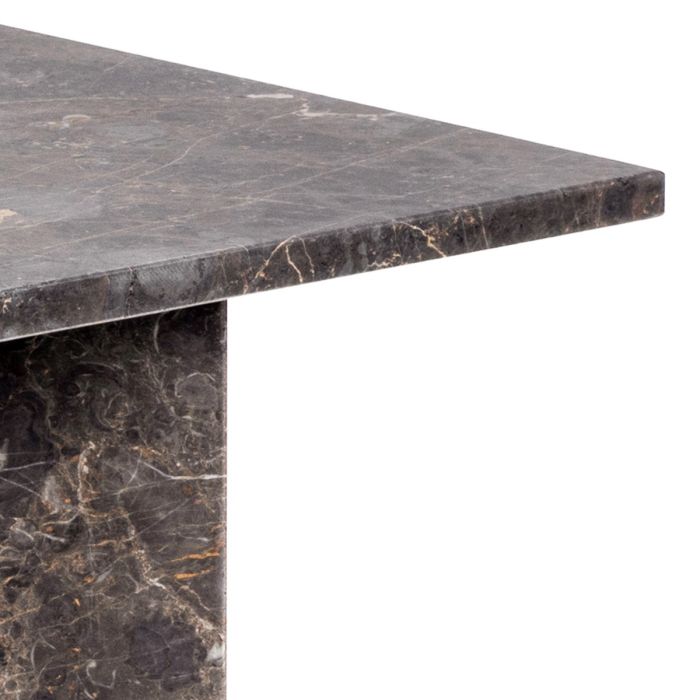 Marble table with a dark, veined pattern on a white background