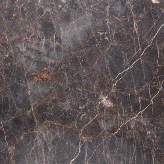 Close-up of a dark marble surface with gray and brown veins