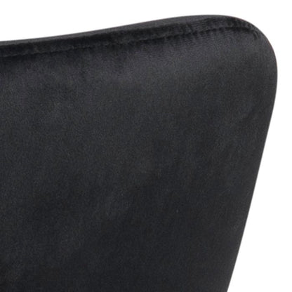 Close-up of a black cushion with a textured surface on a white background