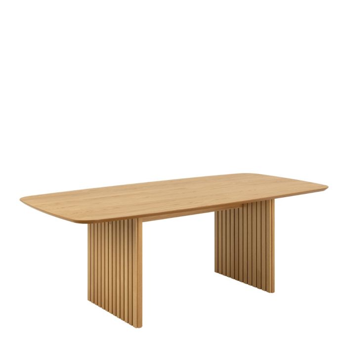 Wooden dining table with unique leg design on a white background