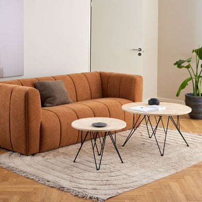 Brown sectional sofa with two coffee tables in a living room setting.