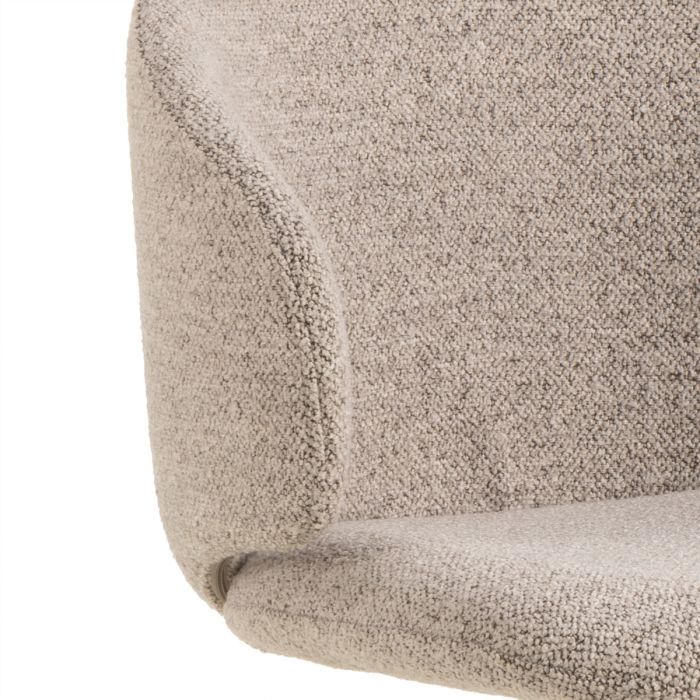Close-up of a textured beige fabric surface