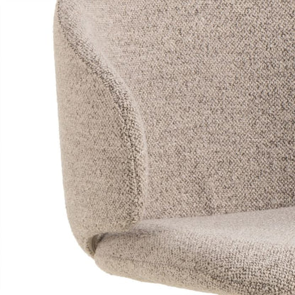 Close-up of a textured beige fabric surface