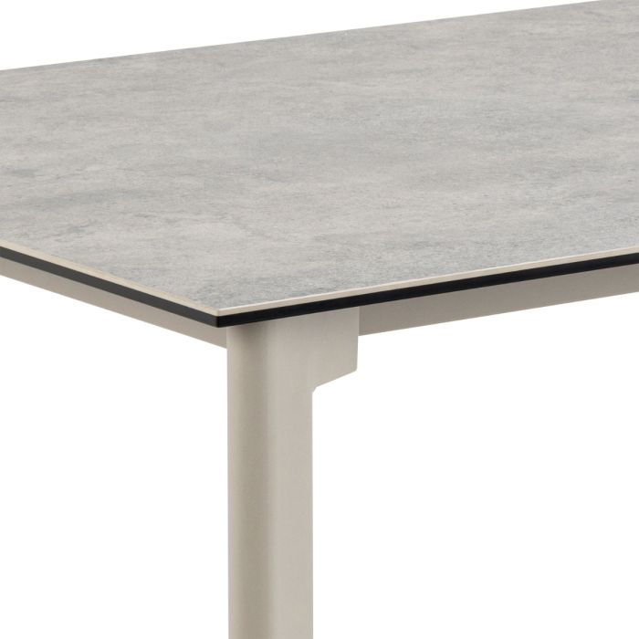 Table with a gray textured top and white base on a white background