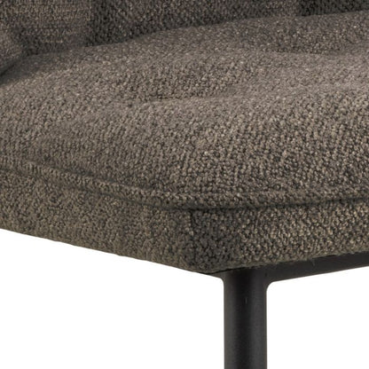 Close-up of a textured brown chair seat with a white background