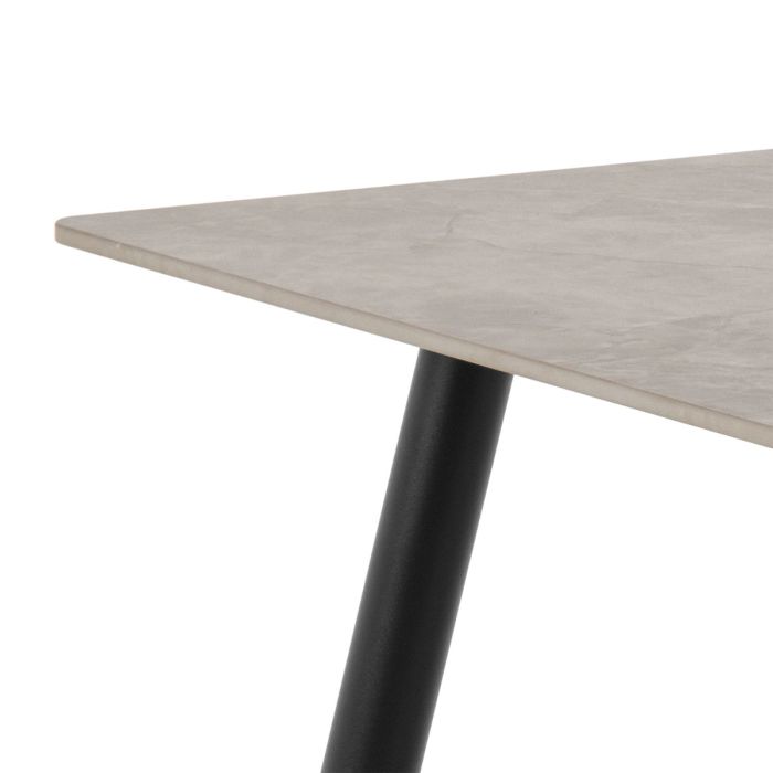 Table with a light gray surface and black metal leg on a white background