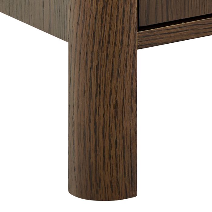 Close-up of a wooden leg on a table with a white background