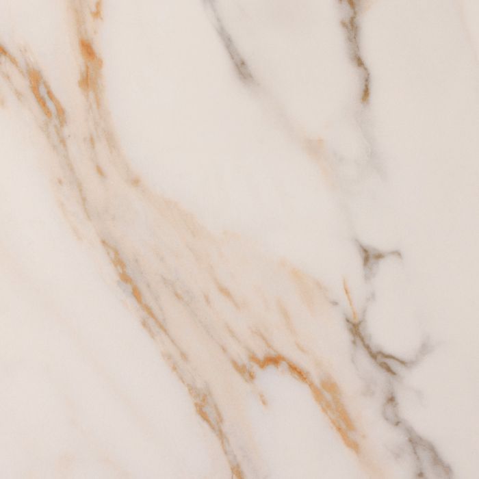 Close-up of a marble surface with beige and brown veins.