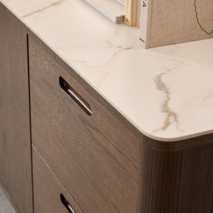 Wooden cabinet with marble countertop and decorative items