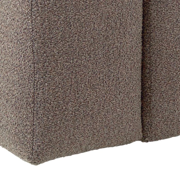 Close-up of a textured brown fabric surface