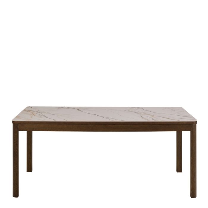 Dining table with marble-like top and wooden legs on a white background
