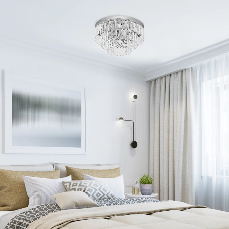 Modern bedroom with a chandelier, bed, and window treatments.