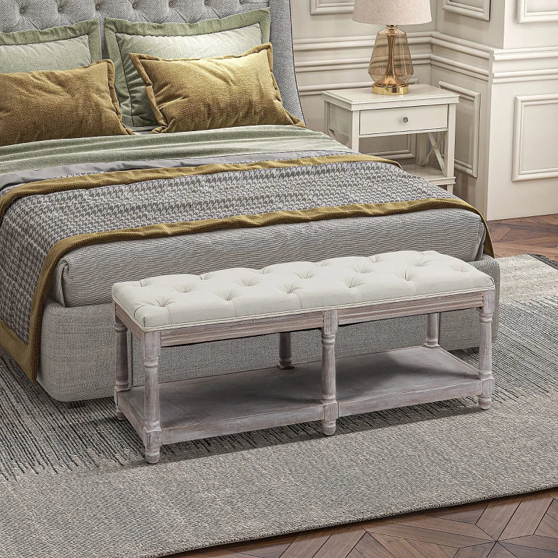Bedroom with a bed, bench, and nightstand.