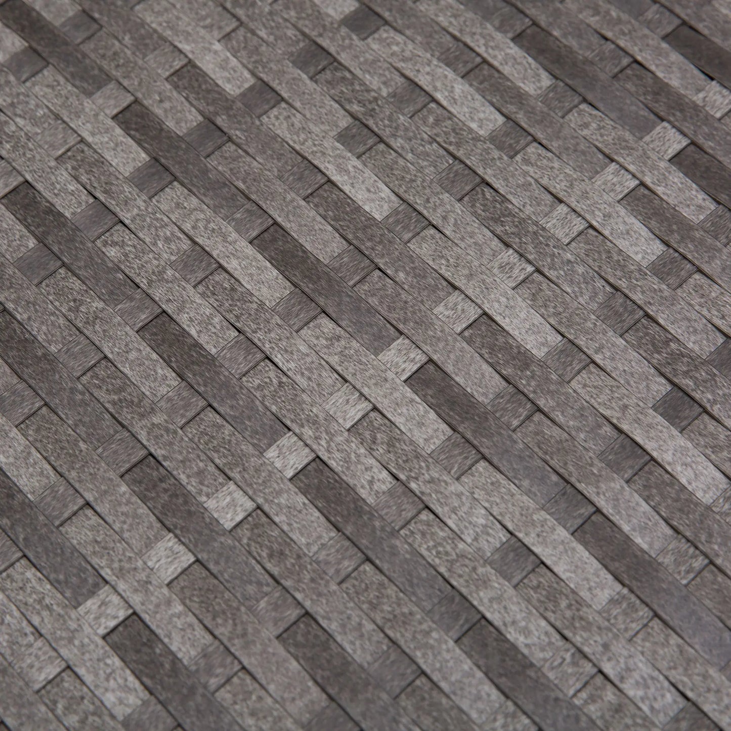 Patterned stone or tile surface with a herringbone design.