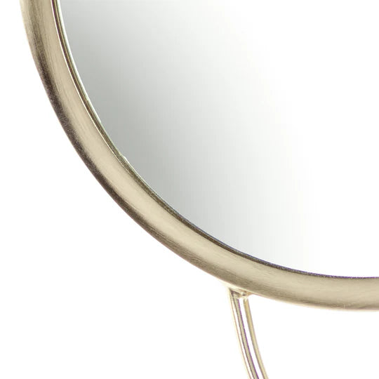Round mirror with a gold frame on a white background
