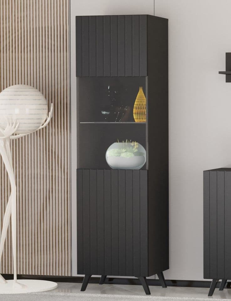 Tall black cabinet with decorative items in a modern interior setting