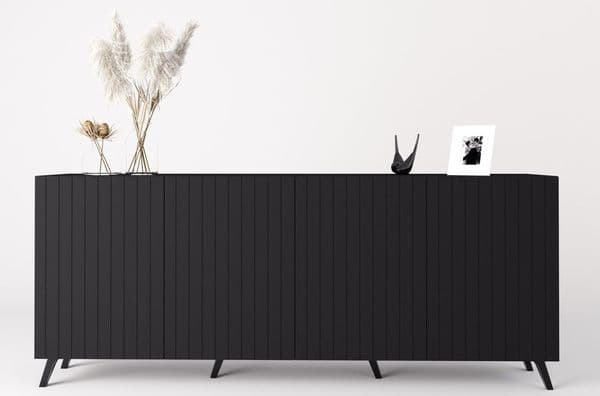 Black sideboard with decorative items on a white background