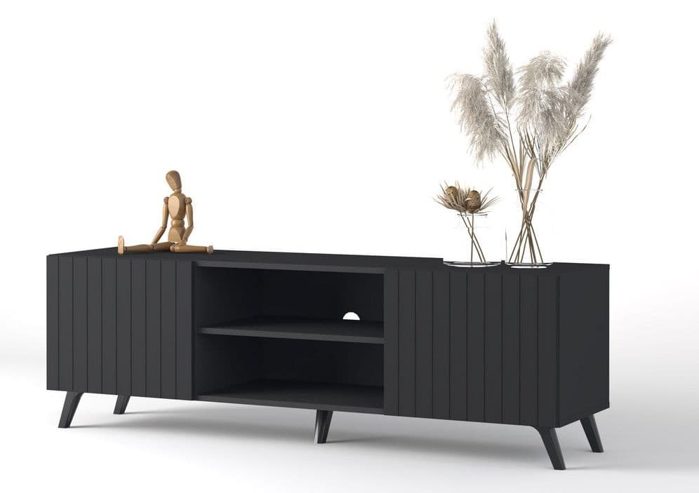 Black entertainment console with decorative items on a white background
