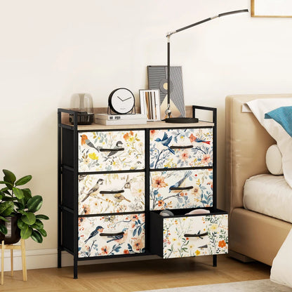 Decorative drawer unit with floral and bird pattern in a bedroom setting