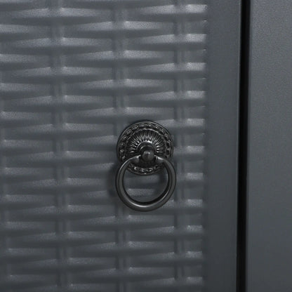 Close-up of a textured gray door with a decorative metal knocker.