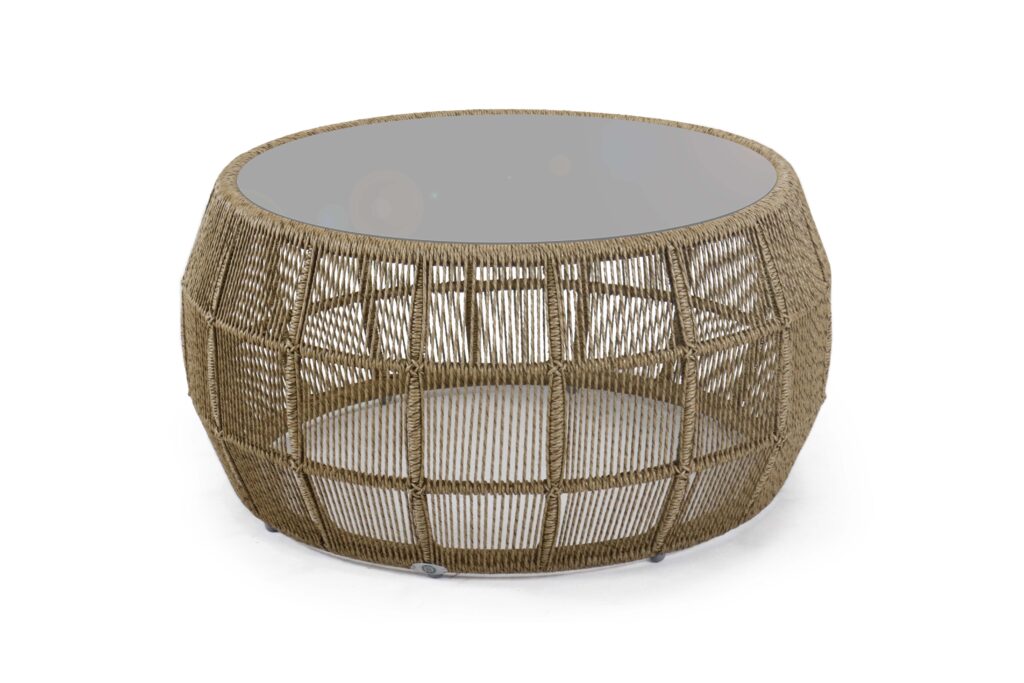 Round woven coffee table with a glass top on a white background