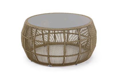Round woven coffee table with a glass top on a white background