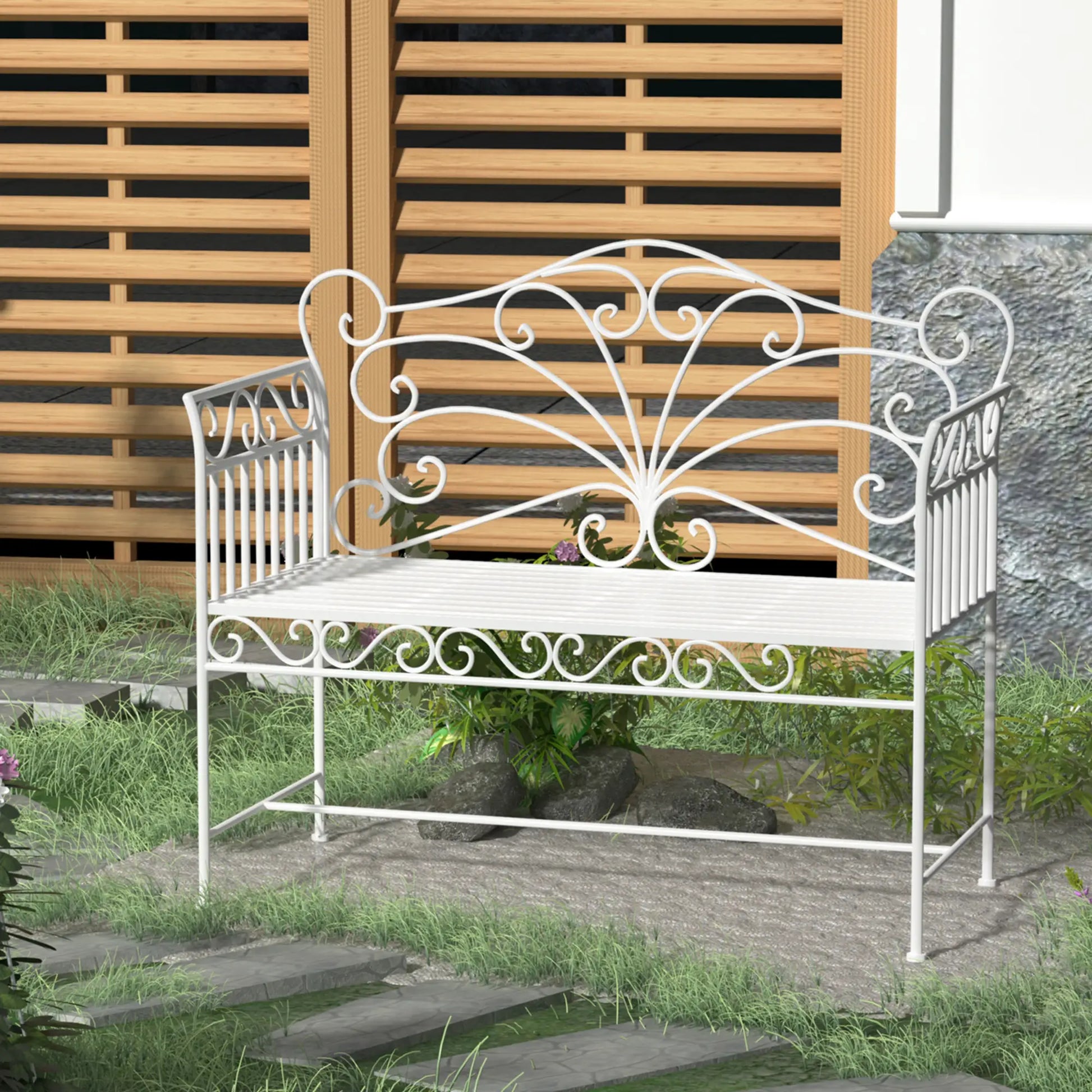White metal garden bench with decorative backrest in a garden setting.