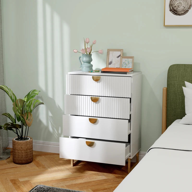 White dresser with gold handles in a bedroom setting